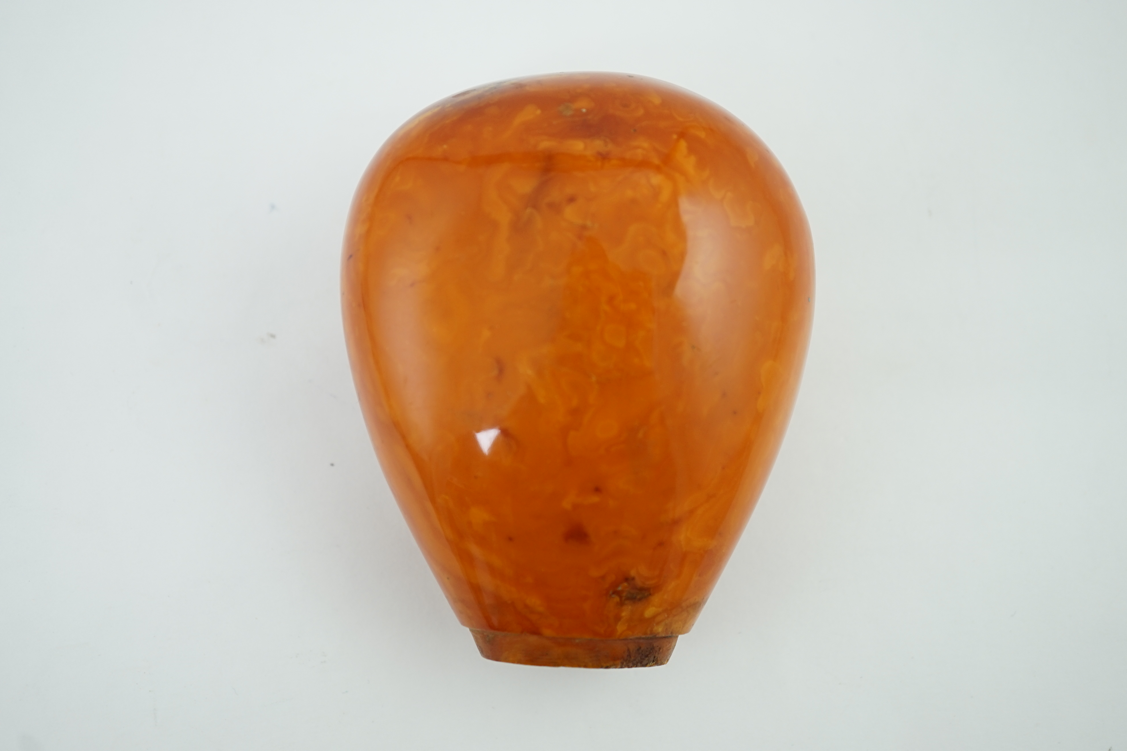 A large amber parasol handle